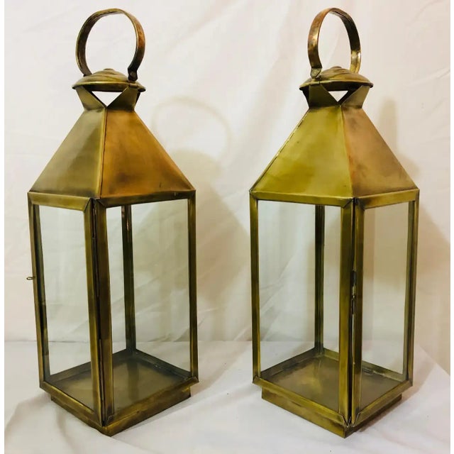 Brass lanterns or candleholder for indoor and outdoor, a pair This classy pair of handmade lanterns or candleholder is...