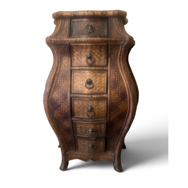 Curvaceous chest of vintage drawers with a woven timber finish to all faces. Each drawer features a metal ring pull...