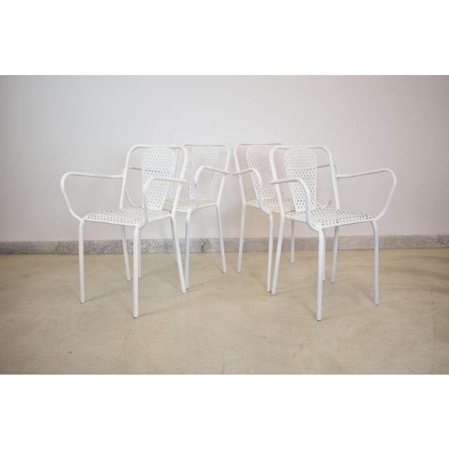 Set of four garden chairs designed by René Malaval, France, 1950s–60s. White lacquered tubular steel with perforated metal...