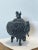 This black color incense burner is made of a bronze mix material, It has carved Foo Dog on lid and flowers around the...