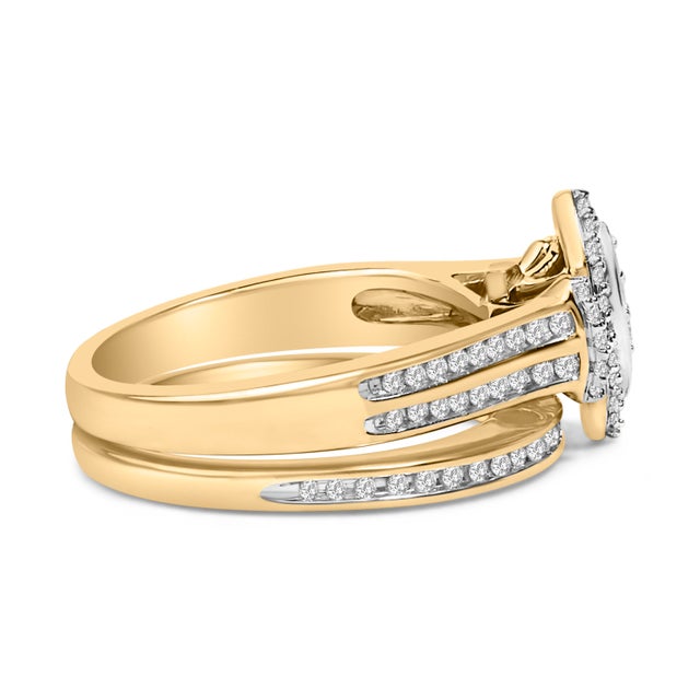 Imbued with the romance and promise of eternal devotion, this ethereal bridal set glistens with a marquise cluster of...