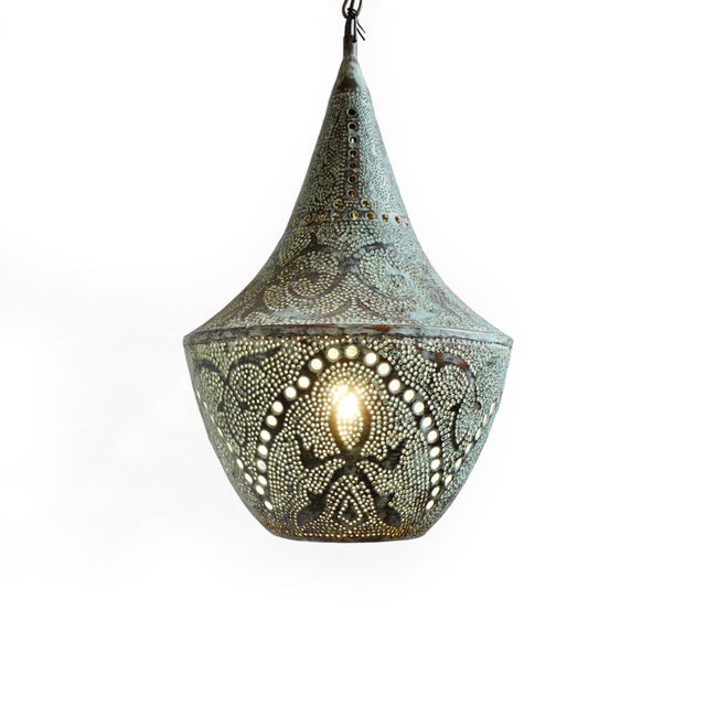Handcrafted verdigris copper pendant light from Indonesia. Showcases intricate, time-honored metalwork with a richly aged...