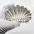 This vintage silver decorative tray depicts a naturalistic sea shell, crafted as a entry hall key bowl, trinket dish, or...