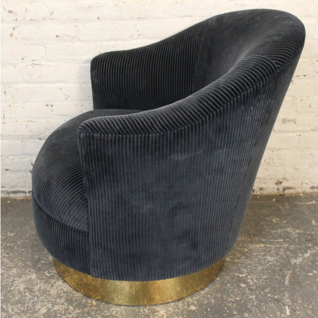 This barrel swivel chair and ottoman are a wonderful example of the mid-century style. With it's subtle but sturdy...