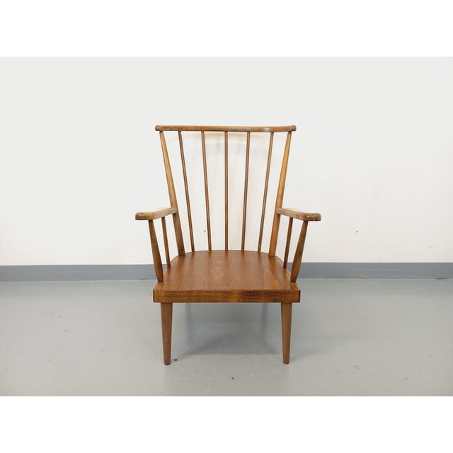 Vintage 1960s armchair in beech wood, by Baumann, Belvoir model, commonly known as the Fan model, produced from 1965...