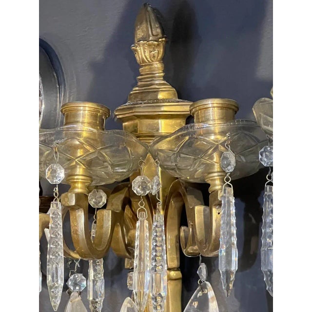 A pair of 1920’s gilt bronze sconces with rock crystals and crystals hangings neoclassic style