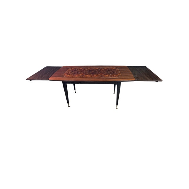The 65" wide table including the leaf extensions measures 99 3/4 " wide. The depth varies from 31 1/2" - 35 1/2" . Each of...