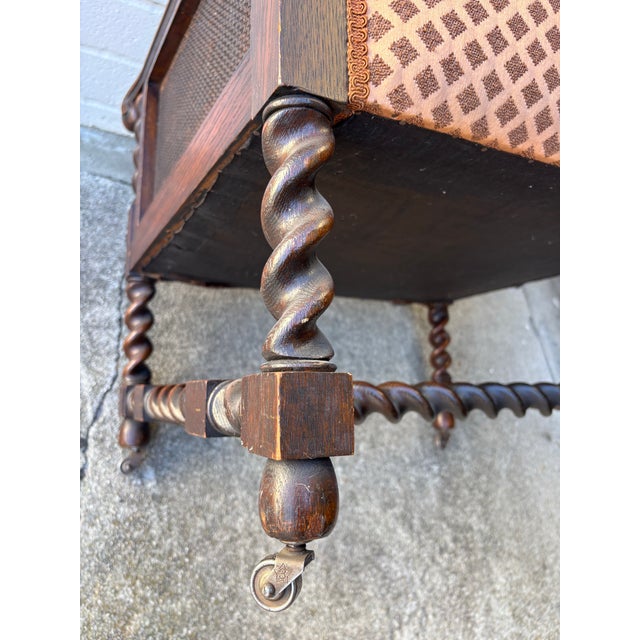 Wood Antique Oak Bergere Armchair Featuring Barley Twist Legs, Arms, and Stretchers, With Cane Paneling Sides and Caster Wheels For Sale - Image 7 of 11