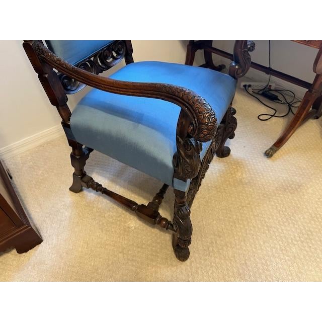 This antique mahogany arm chair or desk chair is a stunning piece of furniture that would make a great addition to any...