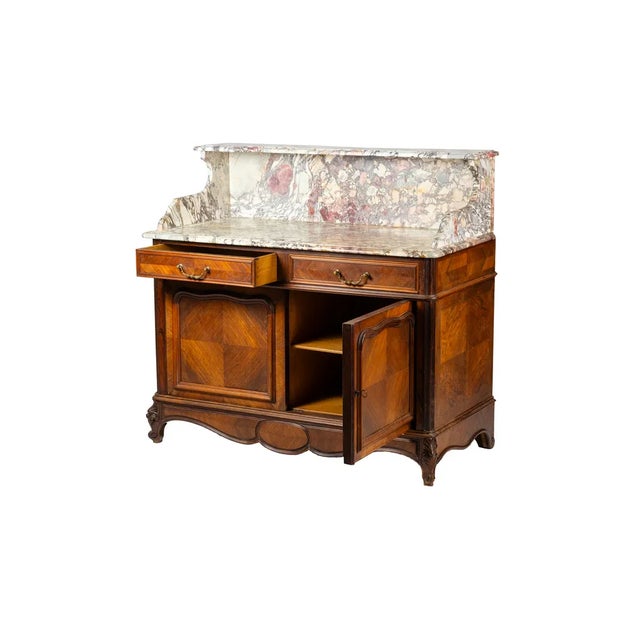 A Louis Philippe antique French vanity unit with richly crafted marble top and flamed walnut structure with two main...