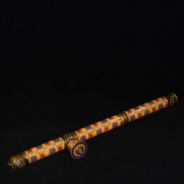 This is a highly decorative vintage opium pipe, featuring a striking cloisonné enamel body and polished brass fittings....