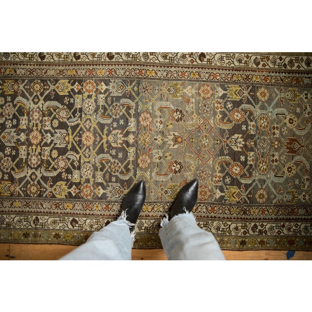 :: Allover covered field in a Herati motif wrapped by a meandering geo0mtetric blossom and vine main and minor borders....