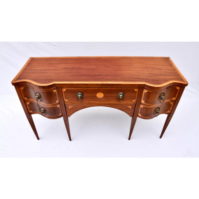 Fabulous early 20th century English style Hepplewhite Style Mahogany sideboard with superb Serpentine figured form,...