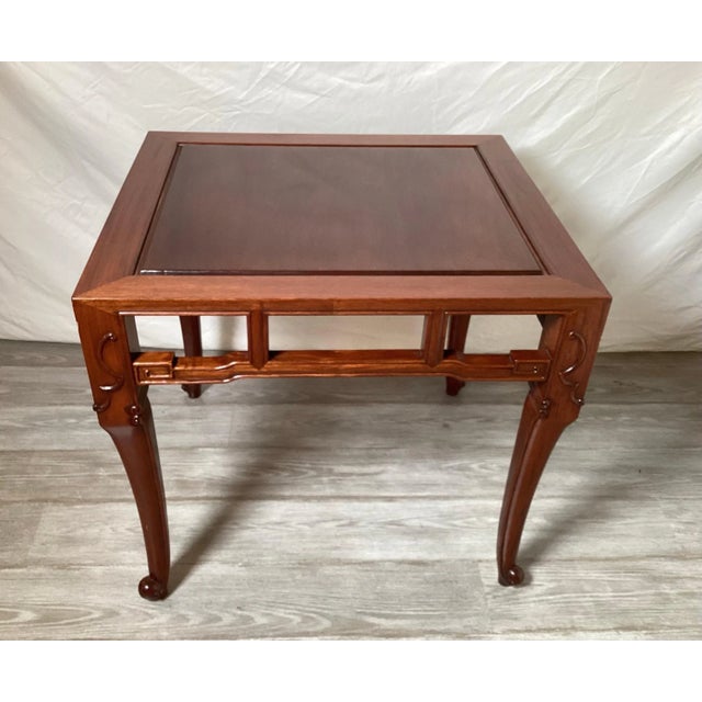 Elegant and simple hand carved Chinese hardwood table with beautifully detailed apron. The table is 24 deep, 25 wide, and...