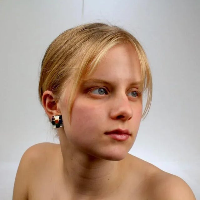 A wonderful pair of Asch Grossbardt earrings. Each earring consists of 14k and is inlaid with lapis, coral, mother-of-...