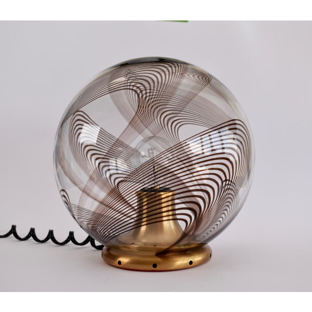 Stunning table light from the 1970s. This lamp was likely made by Lino Tagliapietra, but unfortunately the lamp is not...