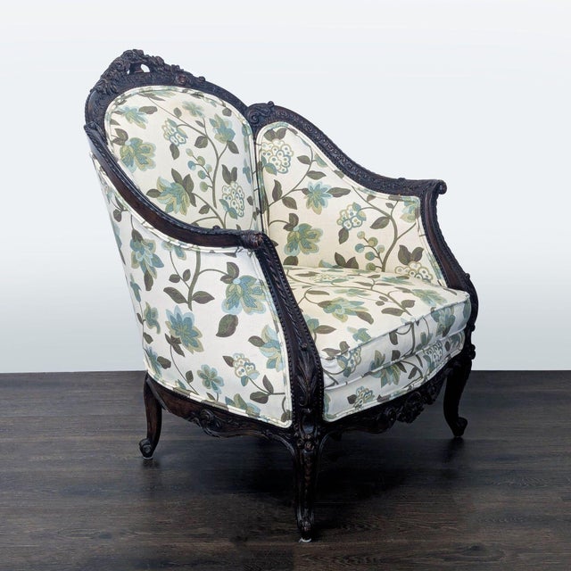 Add a touch of classic style to your lounge with this elegant chair. It features a sturdy, dark wood frame with intricate...