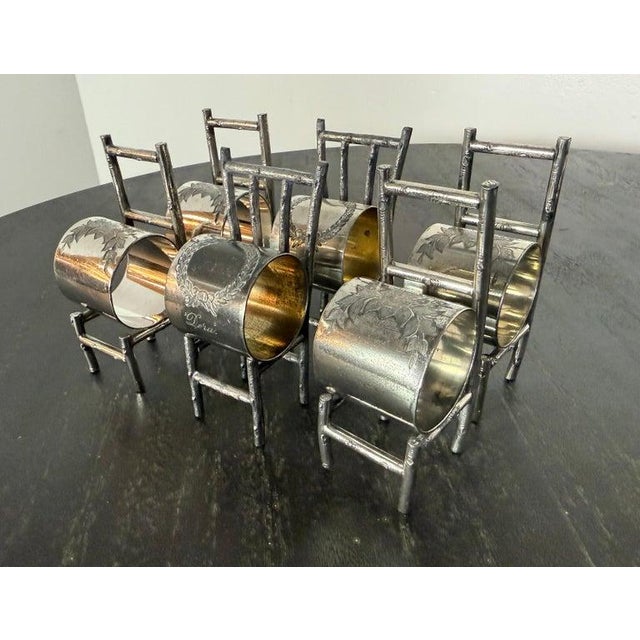 This charming and whimsical set of six antique silver-plated napkin ring holders is cleverly crafted in the form of...