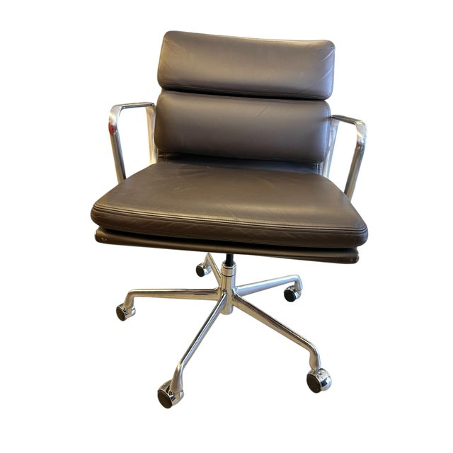 The Herman Miller Soft Pad in Dark Brown Leather Management Height Office Chair was designed by Ray and Charles Eames and...