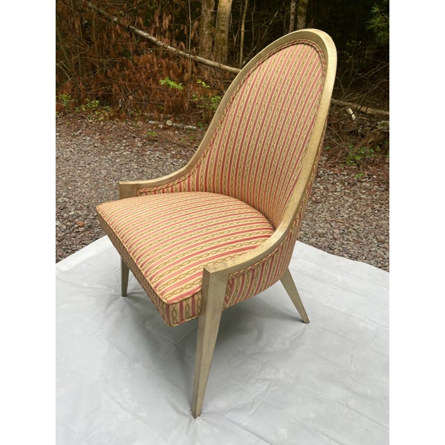 A single vintage Harvey Probber style gondola chair with curved hardwood frame, tapered legs, and a unique blonde painted...