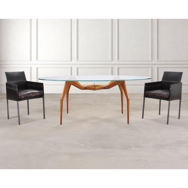 An iconic tailored set of twelve German "Texas" leather dining armchairs designed by Karl Friedrich Forster KFF and...