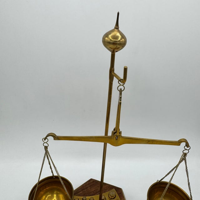 Vintage Precision Balance in Brass and Precious Wood Base Add a touch of scientific elegance and authenticity to your...