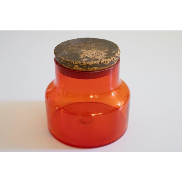 Vintage orange canister by Takashi. 7" tall with cork and 7" diameter at base. Great accent piece and pop of color!