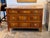 Directoire inlaid commode of three long drawers, the figured walnut fronts framed with line inlay and crossbanding, fitted...