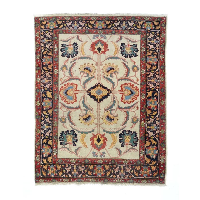 Semi Antique Red Farahan Persian Area Rug The straw-cream field presents a bold, long-armed organizing cross pattern with...