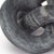 Hand-carved from a single piece of black stone, this abstract sculpture weaves about creating a flowing singular form. Add...