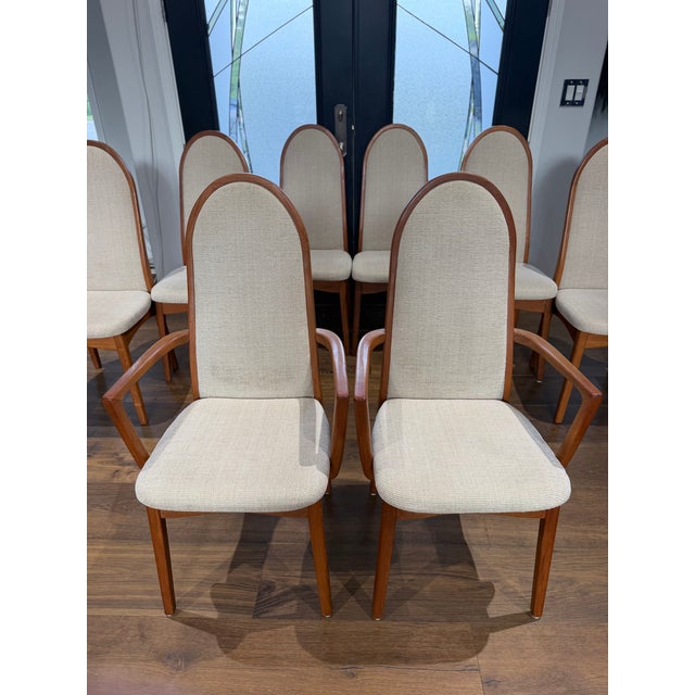 An exceptional set of eight vintage dining chairs by Benny Linden, showcasing the timeless elegance of Scandinavian-...
