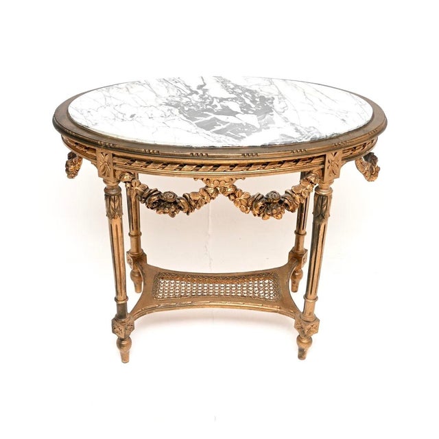 An absolutely beautiful antique French carved gilt wood marble top occasional table, dating from around the 1890-1910...