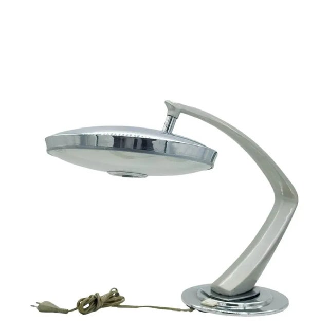 Large desk lamp mod. 'Boomerang 2000'. Enamelled grey/silver steel arm pivoted on round nickel-plated metal base, satin-...