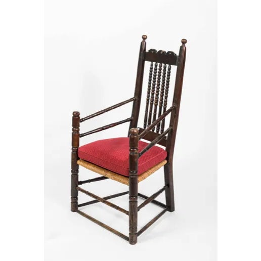 This nice 18th century English oak Bannister armchair has rounded spindles with spools on the back. The base has two sets...