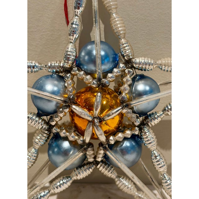 Beautiful Star Shine blown glass, wire and bead ornament designed by Christopher Radko and handcrafted in the Czech...