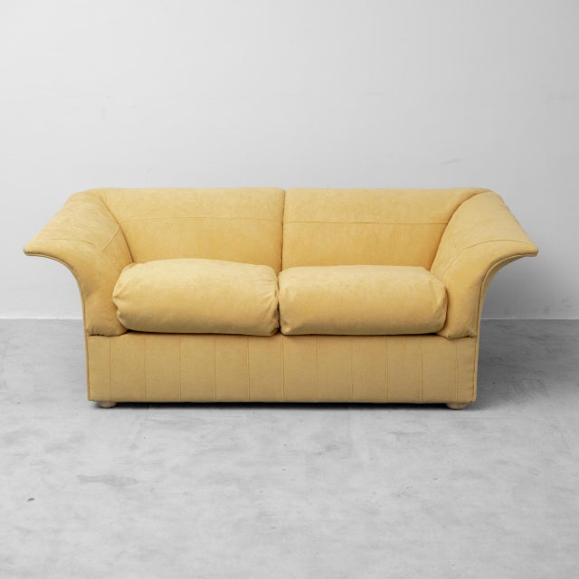 Loto 2-seater sofa. Designed by Luigi Massoni for Poltrona Frau in 1976. Upholstered in mustard-colored fabric. Round...