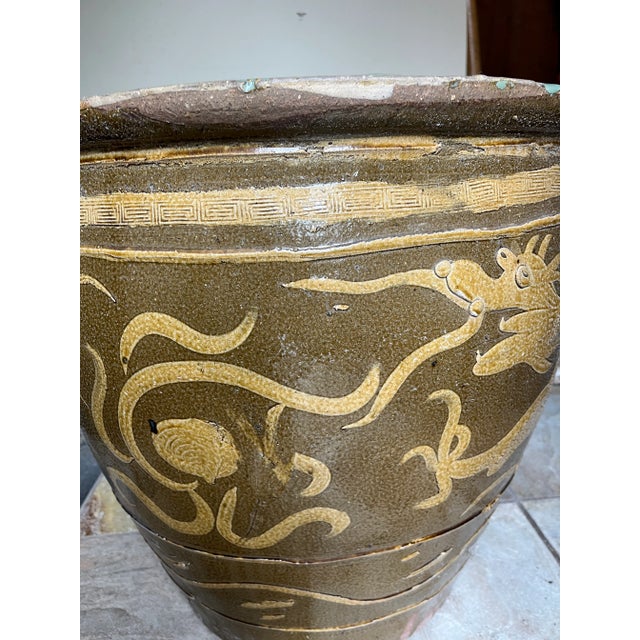 Large thai dragon jar or water jug, could be used as a trash can or a pot for a plant! Gorgeous tan dragon detailing and a...