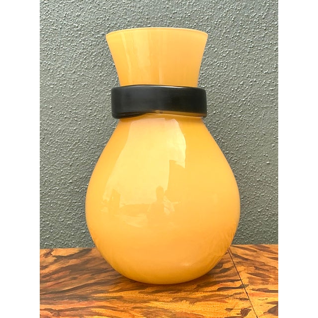 This striking vintage “Fasciati” vase represents a premier collaboration between the renowned Murano glasshouse Salviati...