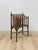 This rare vintage English Canterbury faux bamboo magazine rack on wheels is a beautifully crafted and genuinely...