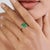 This vintage-style cluster cocktail ring features 1.37 ct of oval-cut green emeralds, set in 14k yellow gold. Each emerald...