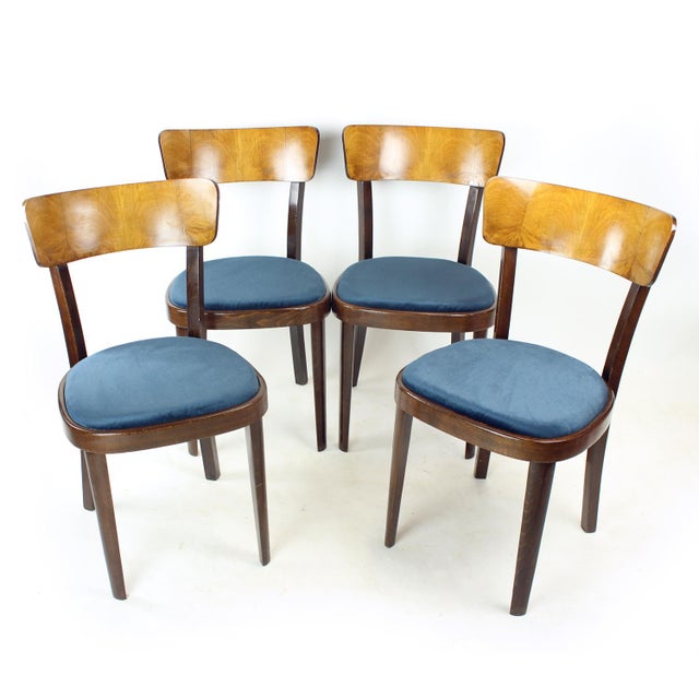 Set of four chairs produced by Tatra in Czechoslovakia in the 1950s. Solid and well-made construction in oak, with...
