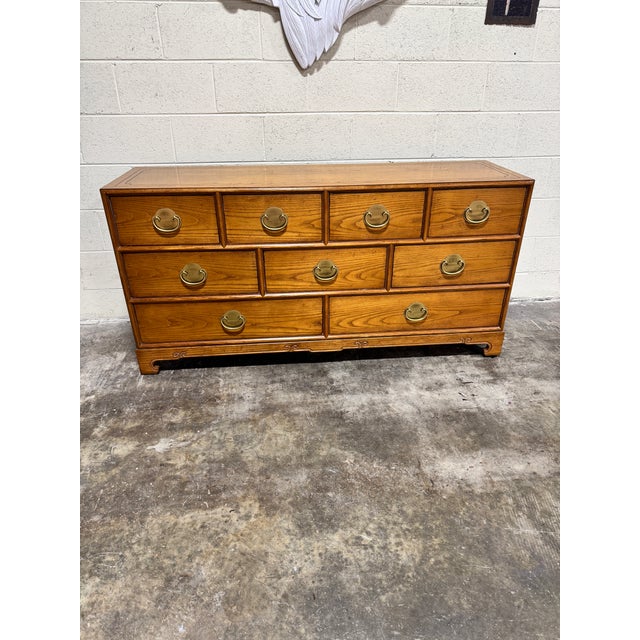 This is a vintage Mid-Century Modern Raymond Sobota for Century Furniture Chin Hua Collection nine-drawer dresser with...