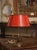 Add warm color and refined French character to a desk, side table, or library with this elegant antique bouillotte lamp....