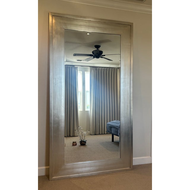 Elevate your space with this stunning, trade-only luxury floor leaner mirror custom finished from Emerson et Cie. This...