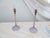 This pair of early 20th century cut glass lamps have a violet tinge to them and come with a pair of later made pleated...