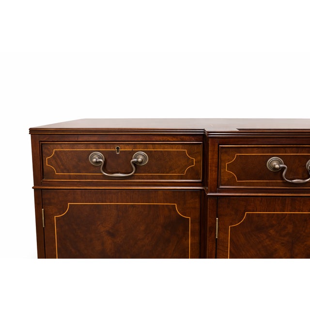 An English sideboard by Trosby Furniture of Sussex, showcasing traditional craftsmanship and refined detailing...