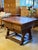 A remarkable antique European oak box table, showcasing the enduring craftsmanship and rustic character of traditional...