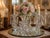 An elegant vintage Cambridge Glass-style crystal epergne and candelabra centerpiece featuring an ornate three-light design...