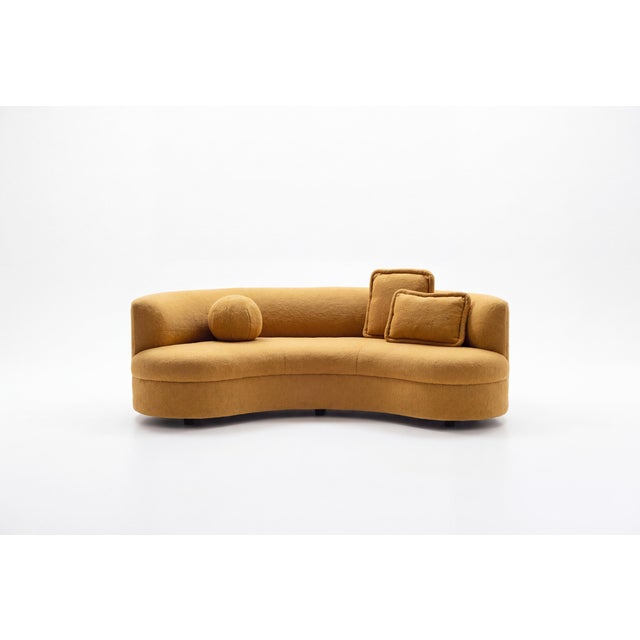 This John Mascheroni curved sofa, is an elegant piece of modern furniture that adds a touch of sophistication to any...
