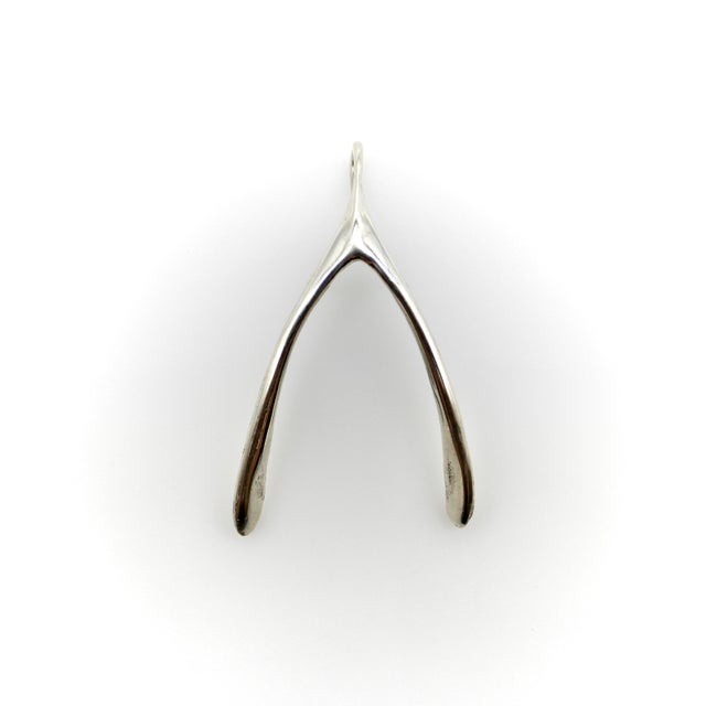 This sterling silver pendant is part of Kirsten’s Corner Signature Collection and was molded from an actual wishbone. I...